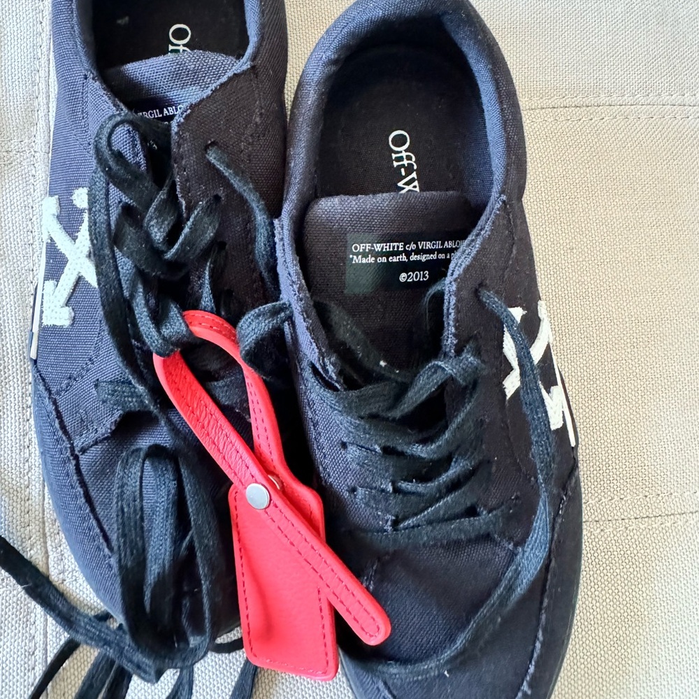 Black colored off-white sneakers